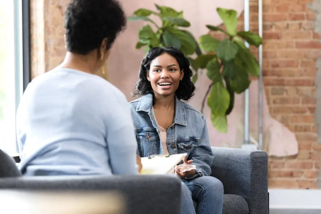 The smiling, cheerful teenage girl clasps her hands and tells the unrecognizable female counselor all about herself.
